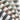 Close-up of Curtarra Alfred Stripe Roman shade fabric swatches, showcasing diverse vertical woven stripe patterns.