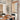 Eloise Jute Motorized Woven Wood Shades paired with decorative drapes, offering healthy light control and a child/pet-safe solution for dining rooms.