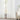 Full-length Alex Velvety Semi Sheer Curtains, white polyester drapes gracefully framing a window, offering soft light filtering.