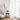 White sheer polyester solid curtains elegantly frame a window, letting in soft daylight.