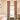 A child's room featuring a window with elegant blush pink blackout curtains on a gold rod