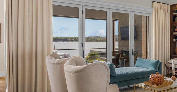 Beige linen farmhouse curtains framing a bright living room window