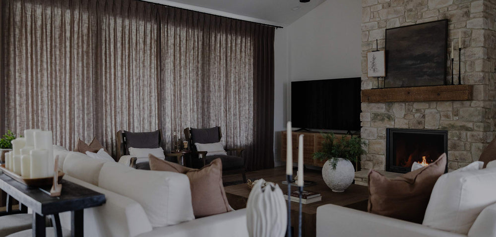Cozy living room with velvet curtains and fireplace showcasing Curtarra Black Friday and Cyber Monday sale promotions