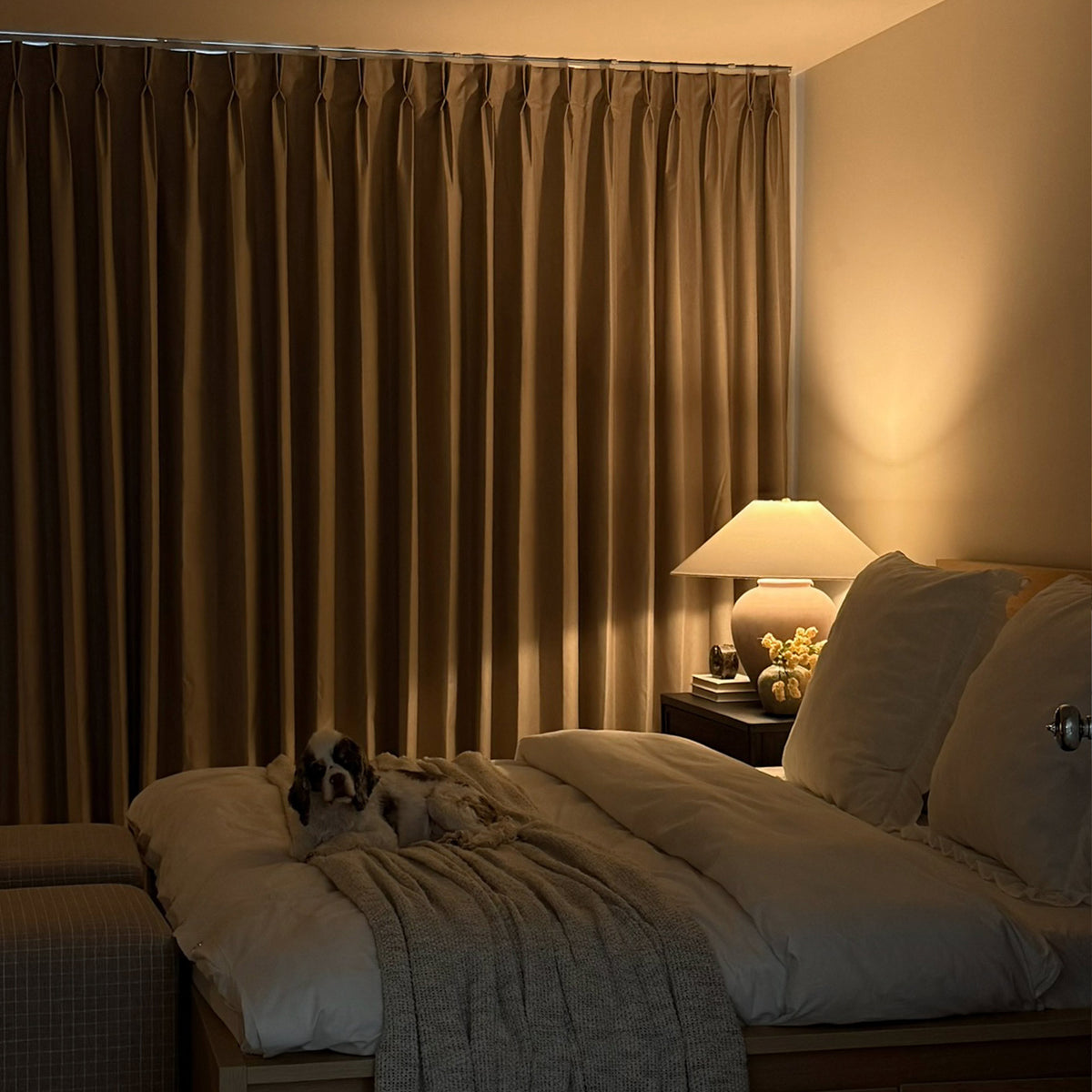 Bedroom with balanced blackout curtains showing perfect darkness and comfort