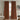 Warm Brown, Brown curtains hanging in a room with a chair and decor.