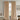 Warm Sand, Beige curtains hanging in a room with a chair and table.