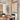 Knotted Tawny, Eloise Jute Motorized Woven Wood Shades paired with decorative drapes, offering healthy light control and a child/pet-safe solution for dining rooms.
