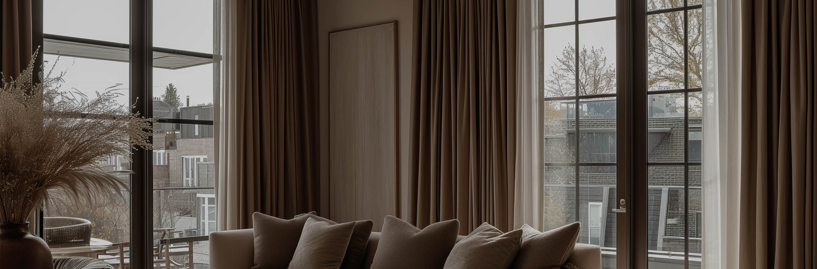 Floor-to-ceiling Gabriel Chenille Custom Herringbone Texture Curtains providing sophisticated window treatments in a contemporary apartment, highlighting their rich texture and potential for light control.