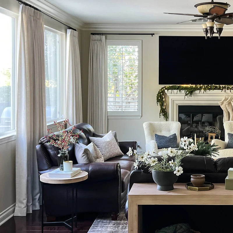 Interior designer demonstrating proper curtain styling techniques