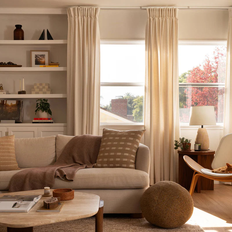 Thermal curtains installed in a sunroom providing temperature control and comfort