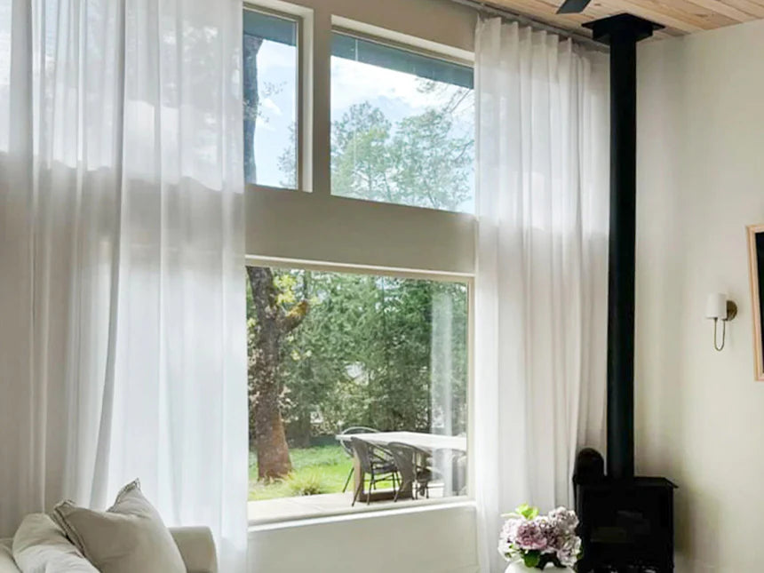 Daytime privacy curtains allowing natural light while maintaining privacy in a living room