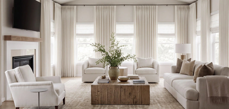 Sunlit new-home living room with custom curtains half-drawn