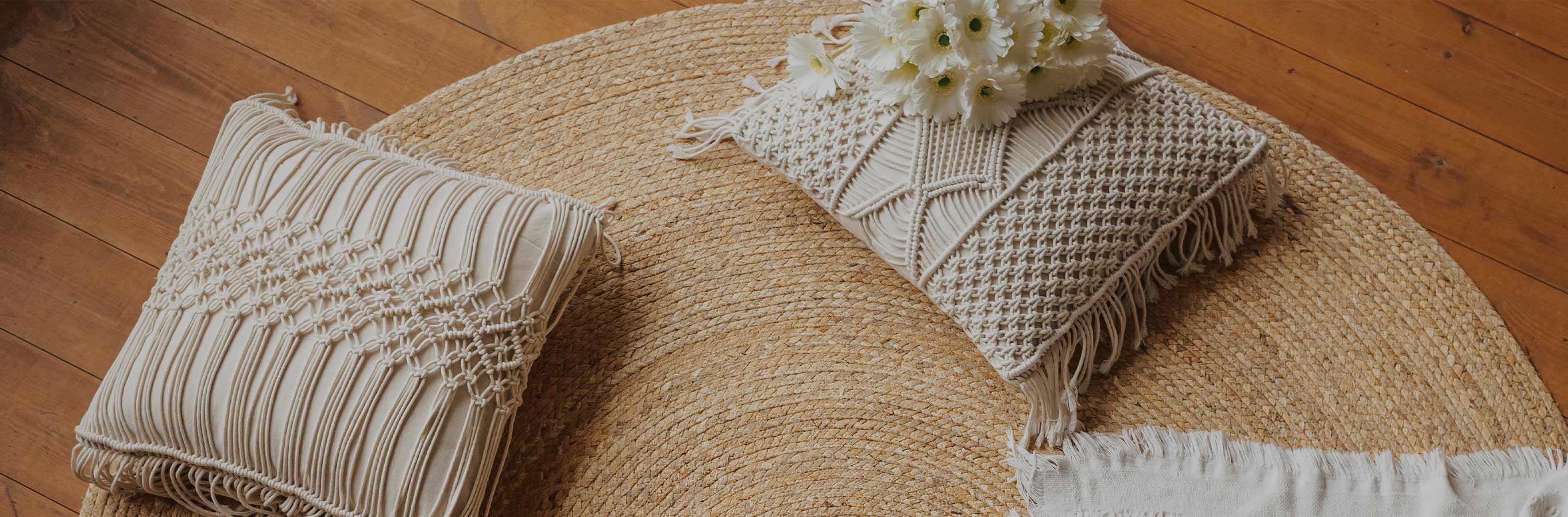 Auden Linen Boho Pattern Curtains complement this cozy, bohemian-styled room with a jute rug and macrame pillows.