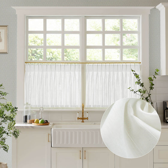 Kitchen with white cabinets, a window with white blinds, and a close-up of a white curtain.