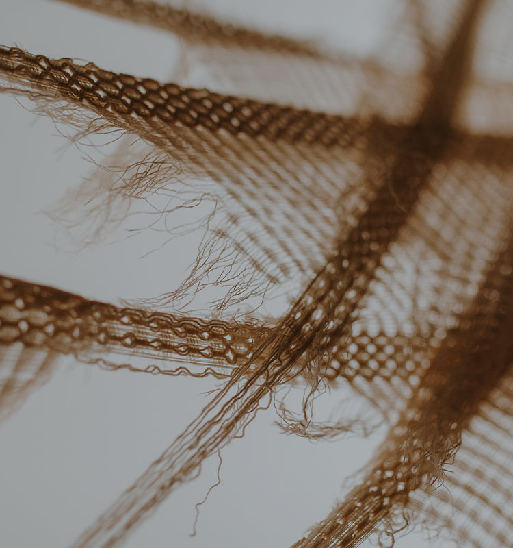 Extreme close-up of Brenda Bohemian Semi Sheer Curtains, highlighting the intricate, airy boho texture and delicate linen blend fibers.