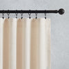 flat panel curtains hang on black rod with rings and clips
