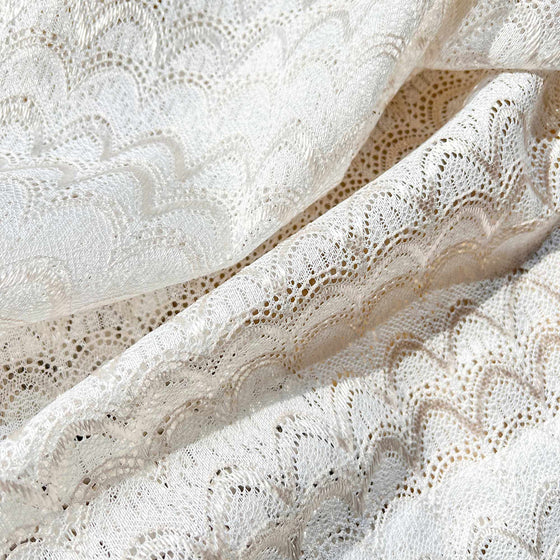 White and Champagne, Close-up of textured white fabric with intricate patterns