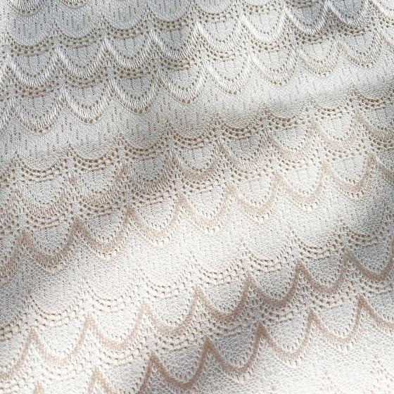 White and Champagne, Close-up of textured fabric with scalloped pattern