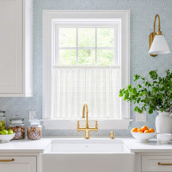 White and Champagne, Modern kitchen with white sink, gold faucet, and decorative elements.