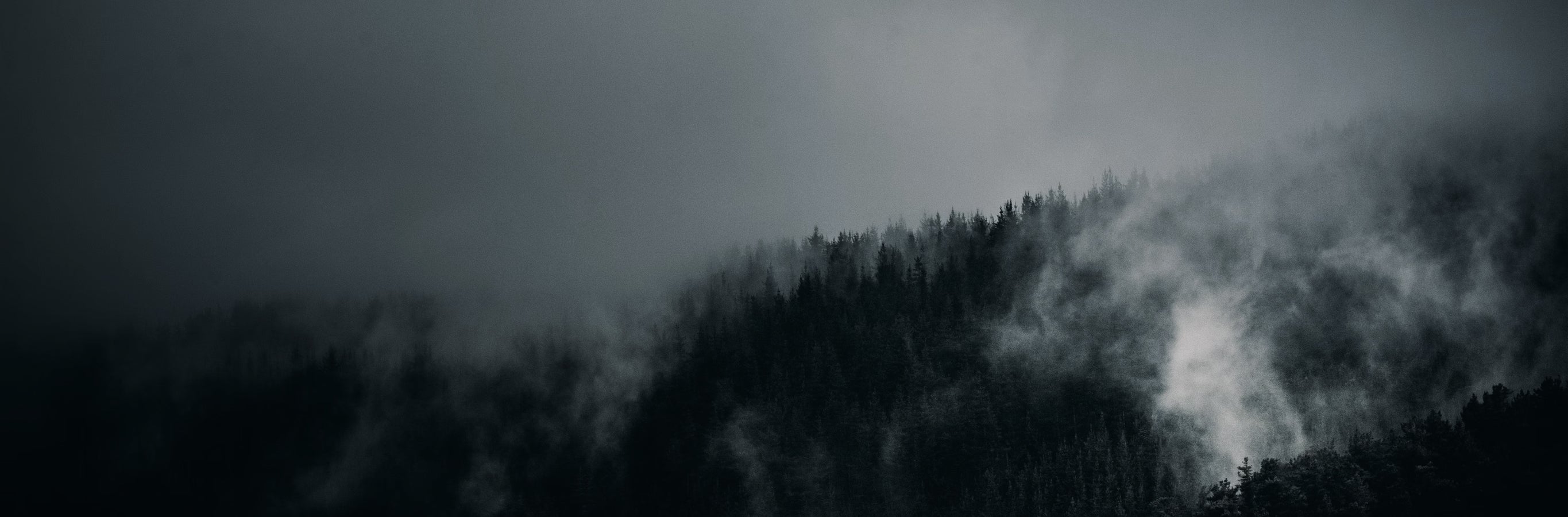 Dark, misty mountains evoking the serene, room-darkening ambiance provided by the Lita Gorgeous Italian Velvet Curtains for ultimate privacy.