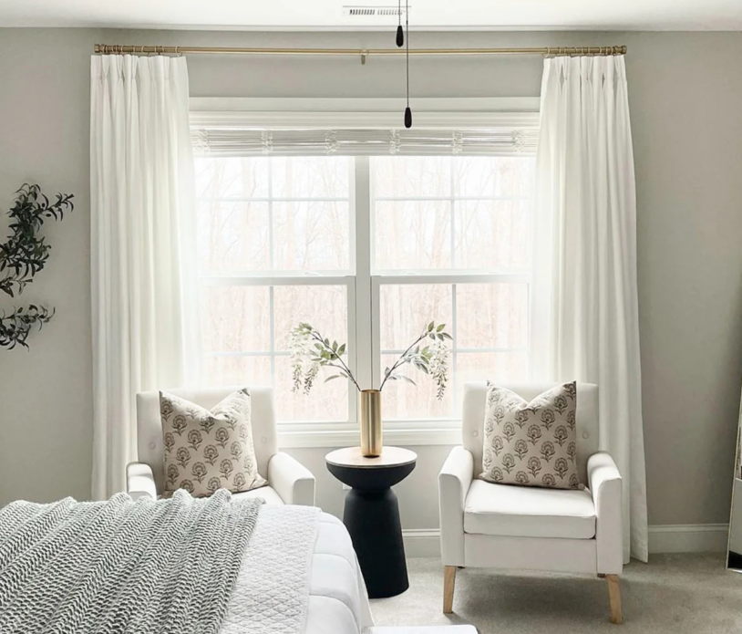 Bedroom with privacy curtains allowing sunlight while maintaining privacy