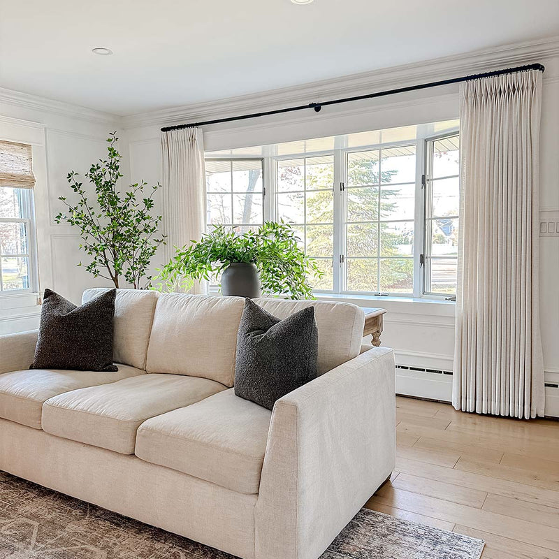 Professional curtain installation for sunny living room windows